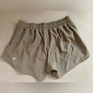 Lululemon grey-green running shorts with built-in mesh underwear, size 6